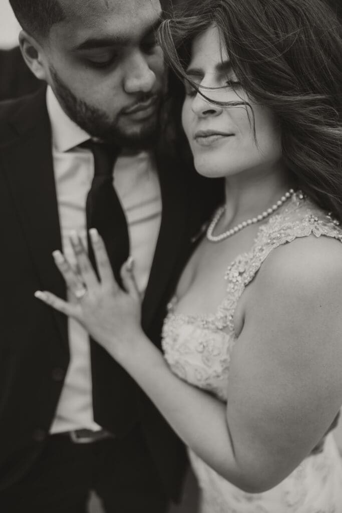 wind blowing brides hair black and white photo