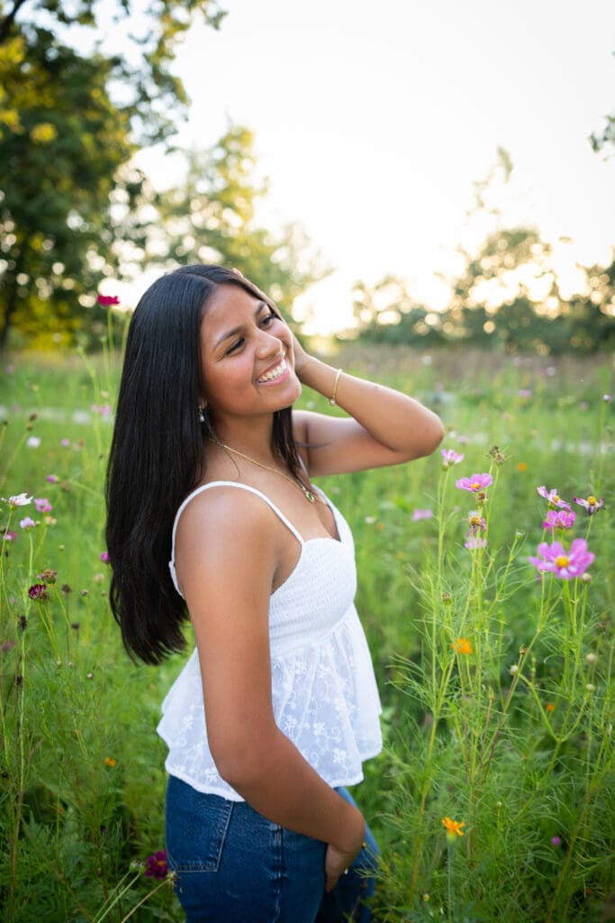 senior girl photos outside spring flower field