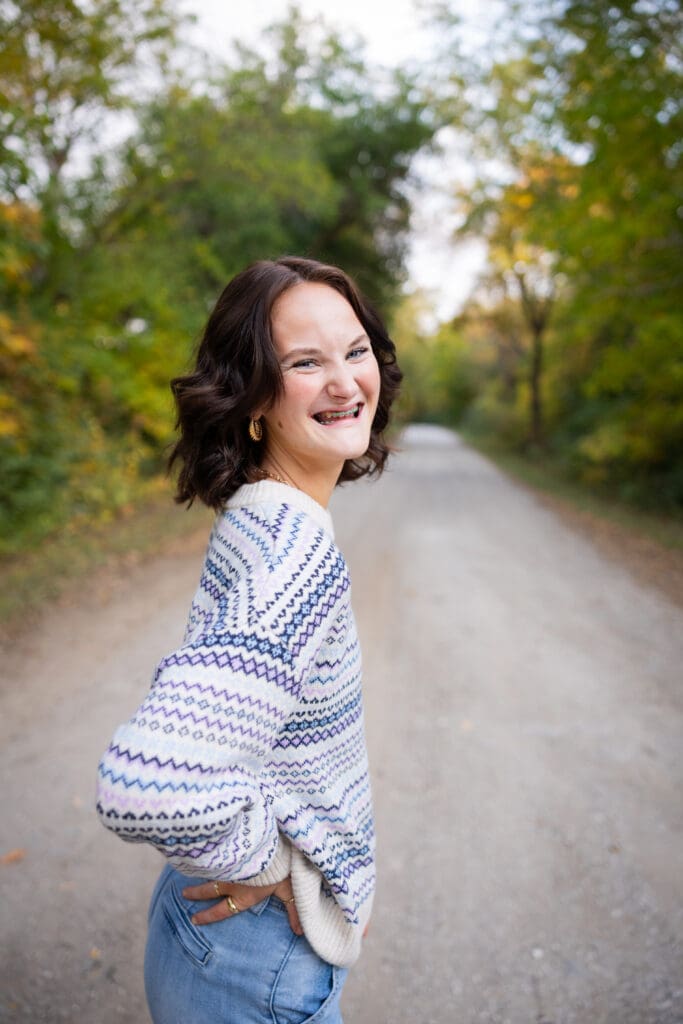 Fall Senior Girl Photos standing on the road in fall