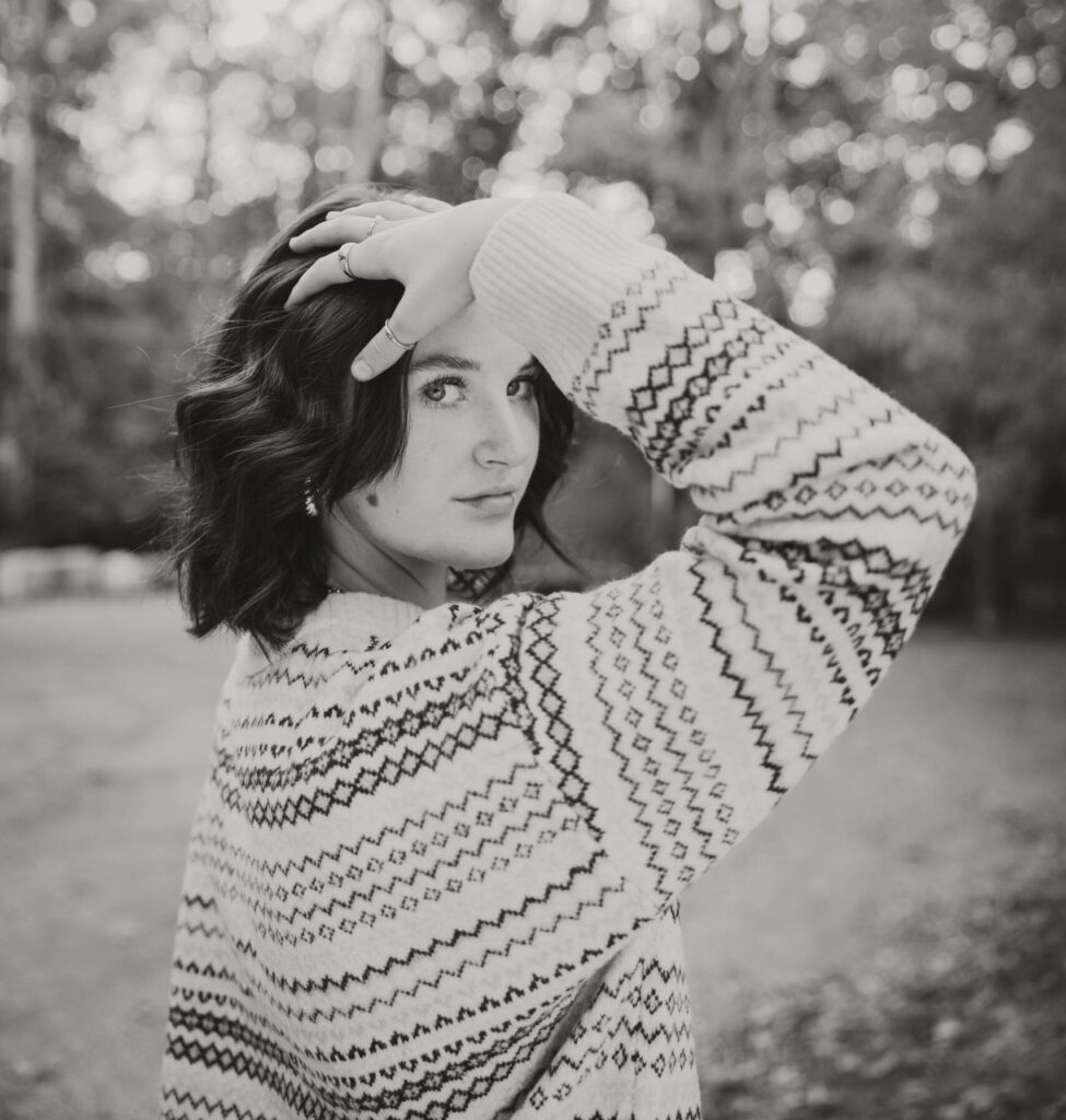 black and white senior girl in sweater photo