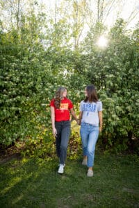 Bestie College Tee Photo Walking Outdoors Floral Backdrop Iowa Senior Photographer 
