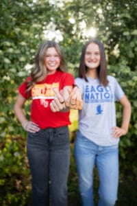 Bestie College Tee Photo Outdoors Floral Backdrop Iowa Senior Photographer Making a heart