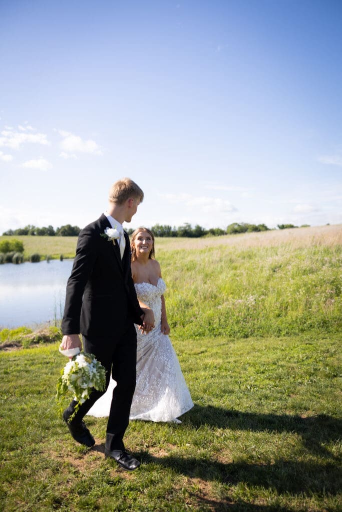 bride and groom smiling looking at each other